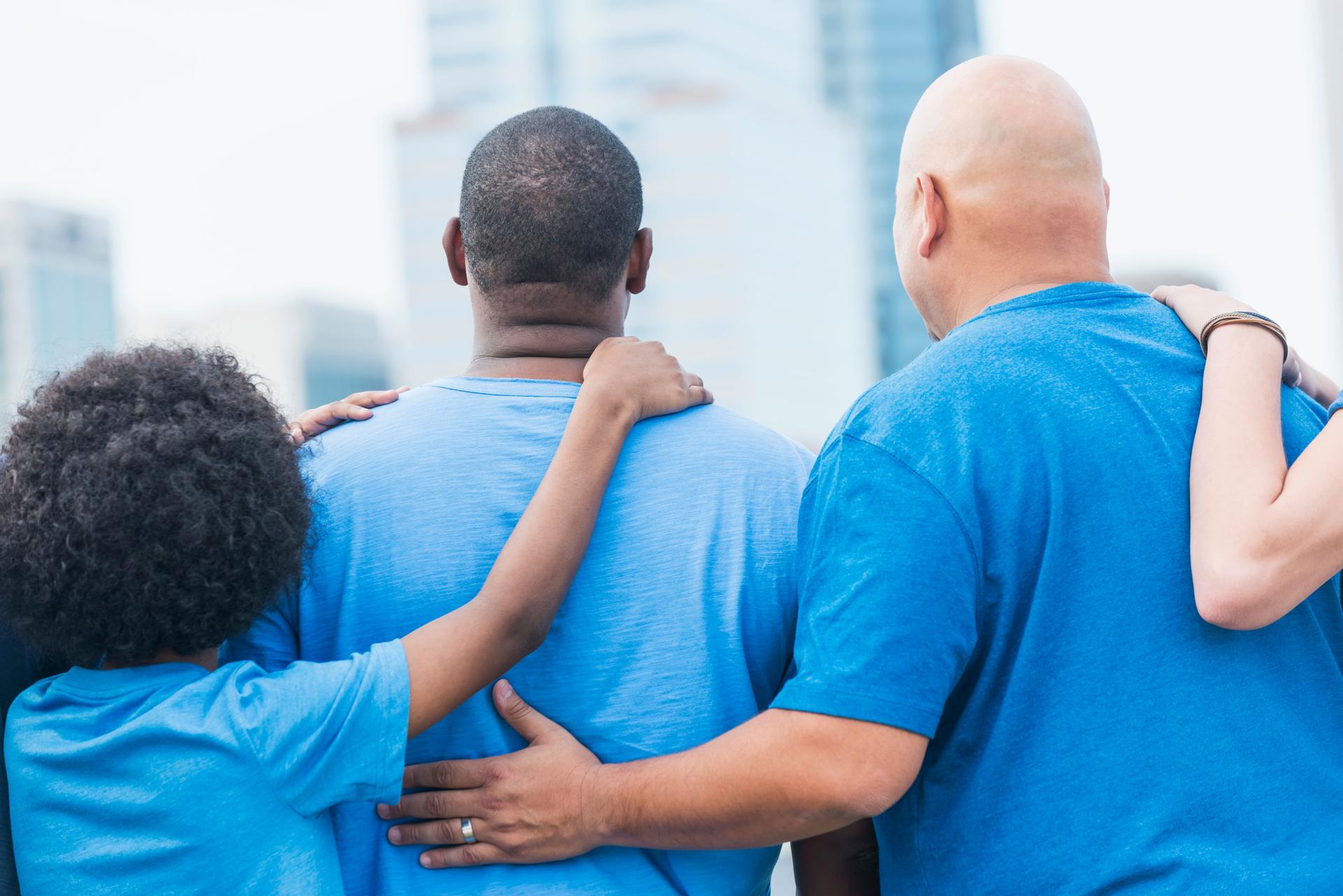 Rear view of multi-ethnic group, father and son